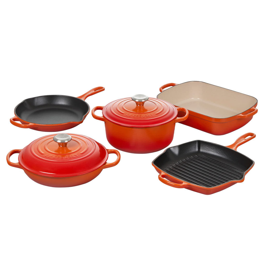 https://discovergourmet.com/cdn/shop/products/Le-Creuset-7-Piece-Signature-Cast-Iron-Set-Flame-Discover-Gourmet.jpg?v=1672342599